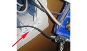 Wall power outlet ground wire turns black due to Chinese drywall corrosion.
