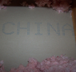 Picture of toxic Chinese drywall manufacturer markings on back - blue China stamp on KPT sheetrock.